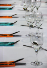 Glass, fork, dinner on a table.