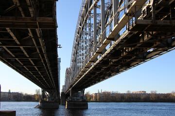 Fototapeta premium Arched spans of the rilway double-track bridge. The view from under the bridge