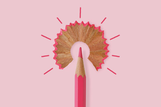 Pink pencil like a light bulb on pink background - Concept of women and creative thinking