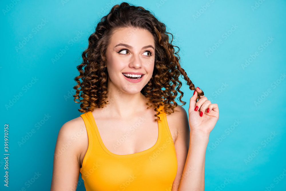 Canvas Prints Photo of lovely dreamy student girl excited look empty space play curl funny wear yellow singlet isolated blue color background