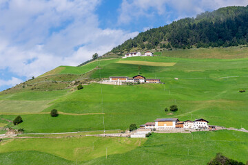 Obraz premium Panoramic view of the Silandro mountain and the pastures of this rural area, South Tyrol, Italy