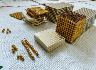 montessori golden material mathematics number decimal system number unit ten hundred and one thousand
