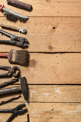 Old vintage household hand tools still life on a wooden background with copyspace and place for text