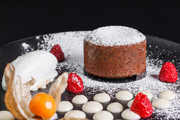 Chocolate lava cake with ice cream On black. Menu design. Horizontal close up.