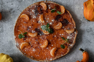 
Homemade pumpkin pie on different backgrounds.