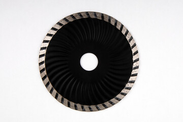 Diamond disc on a white background. Concrete, stone and tile cutting. Work and tools