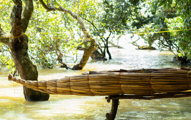Old traditional papyrus boat of Ethiopian fisherman on shore of peninsula, Bahir Dar