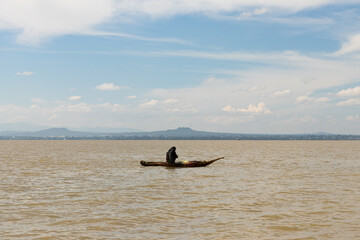 Fisherman on traditional wooden papyrus boat on lake tana in Ethiopia
