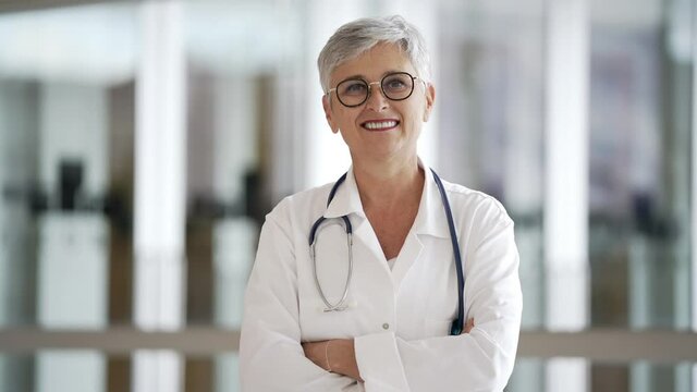Portrait of mature woman doctor with eyeglasses working in hospital office