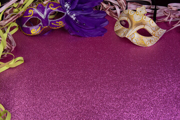 Carnival masks, Venetian masks on shiny surface with streamers, selective focus.