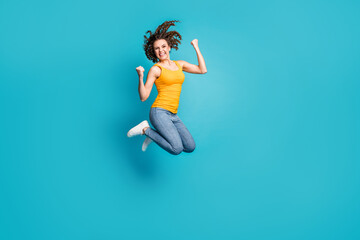 Fototapeta na wymiar Full body photo of crazy lady jump high up air best win success wear casual outfit isolated blue color background