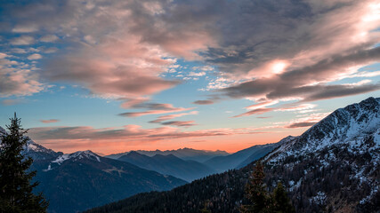 Naklejka na ściany i meble panoramic sunset views of the snowy peaks of the Italian Alps