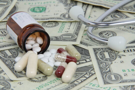 Pills, bottle, USA dollar. Concept for expensive medicine, development, drugs.