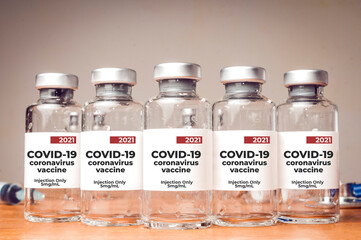 Covid-19 coronavirus vaccine vials lined up on a table