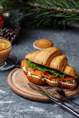 New Year's breakfast with croissants. New Year's croissant with red fish and avocado. New Year and Christmas concept