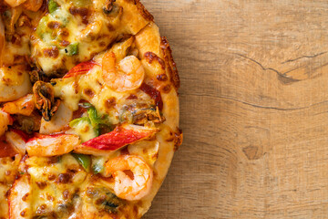 seafood pizza on wood tray