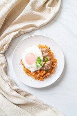 Kimchi fried rice with fried egg and pork