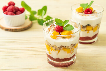 homemade mango and raspberry with yogurt and granola