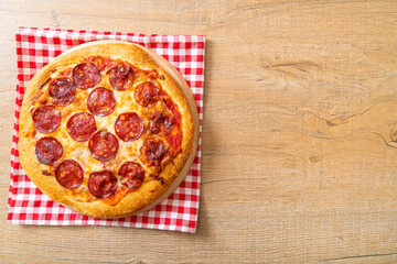 pepperoni pizza on wood tray