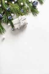 Christmas gift, fir branches on white. Xmas greeting card with copy space.