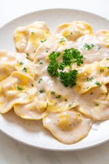ravioli pasta with mushroom cream sauce and cheese