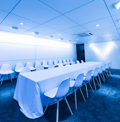 An indoor conference room with blues scenes