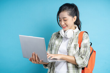 students holding computers determined to study