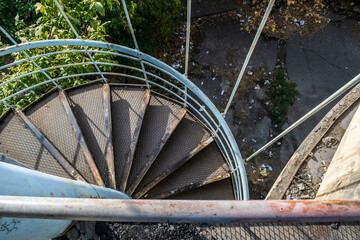Old abandoned cable car station in Yerevan, spiral metal staircase