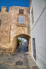 Arch in the walled compound erected between the 10th and 12th centuries in Vejer de la Frontera, a...