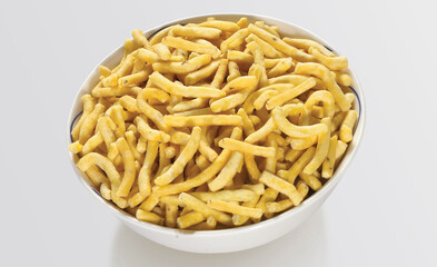 Bhavnagari Gathiya or gathia, ganthia, ganthiya, papdi, Champakali made by gram flour, Indian Pouch Packing Street Food, Namkeen or namkin, selective focus - Image