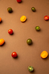 various kinds of mini tomatoes on brown background
