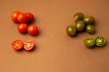 various kinds of mini tomatoes on brown background