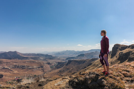 A hiker admiring the beautiful wide-angle view from a mountain top in the Golden Gate National Park.