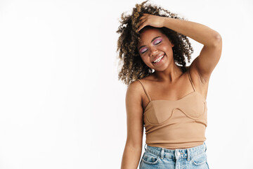 Joyful african american girl with piercing laughing at camera