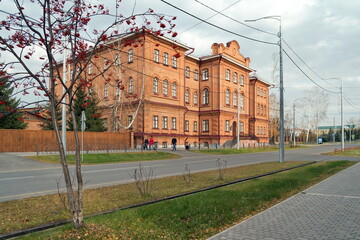 Fototapeta na wymiar View of the old building of the Yenisei men's gymnasium (1886), now the secondary school No. 1 named after Kytmanov.