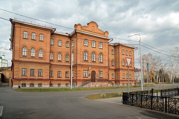 The old building of the Yenisei men's gymnasium (1886), now the secondary school No. 1 named after Kytmanov. Yeniseisk. Krasnoyarsk region. Russia.
