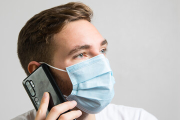 Businessman with mask talking on the phone