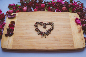 Colored pepper on a wooden Board