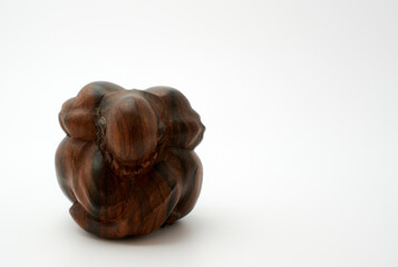  Wooden buddha statue. The weeping buddha on white background