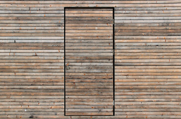 Wooden surface with a built-in door. Abstract wooden background. Door made of wooden planks.