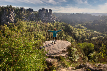 Enjoying freedom - rear view of a woman at Elbe Sandstone