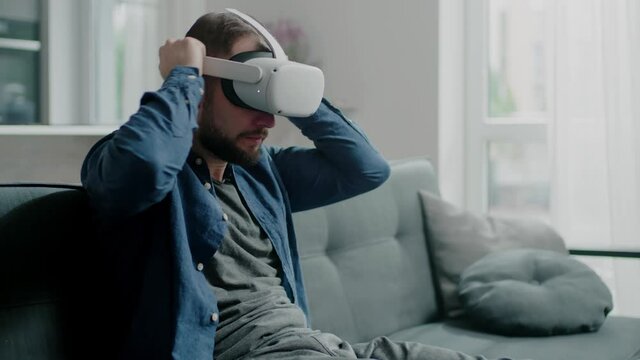 Attractive Male Put On Modern Virtual Reality Glasses