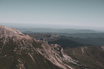 View of endless mountain ranges in the haze of the day