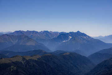View of endless mountain ranges in the haze of the day
