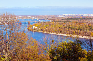 Fototapeta na wymiar Landscape with a view of the Harbour Bridge across Dnipro, Kyiv, Ukraine