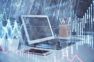 Financial graph colorful drawing and table with computer on background. Double exposure. Concept of...