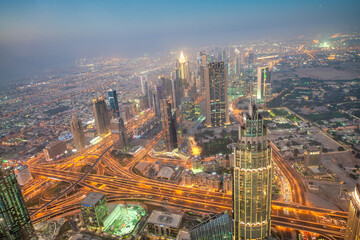 Fototapeta na wymiar DUBAI, UAE - DECEMBER 4, 2016: Aerial night view of Downtown Dubai from top of the tower