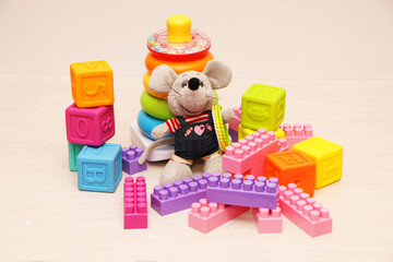 Children's toys, colorful plastic bricks at the table.