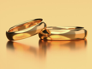 Two wedding gold rings lie next to each other. Love concept