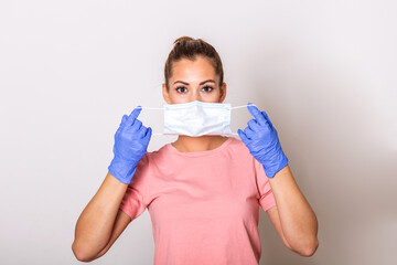 Portrait of young woman wearing face protective mask to prevent Coronavirus and anti-smog. Portrait of young woman wearing face mask. Covid-19 prevention concept